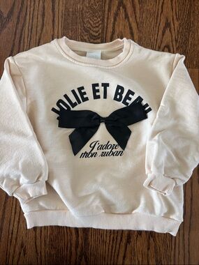 Sea Cream Sweatshirt with Black Bow Graphic